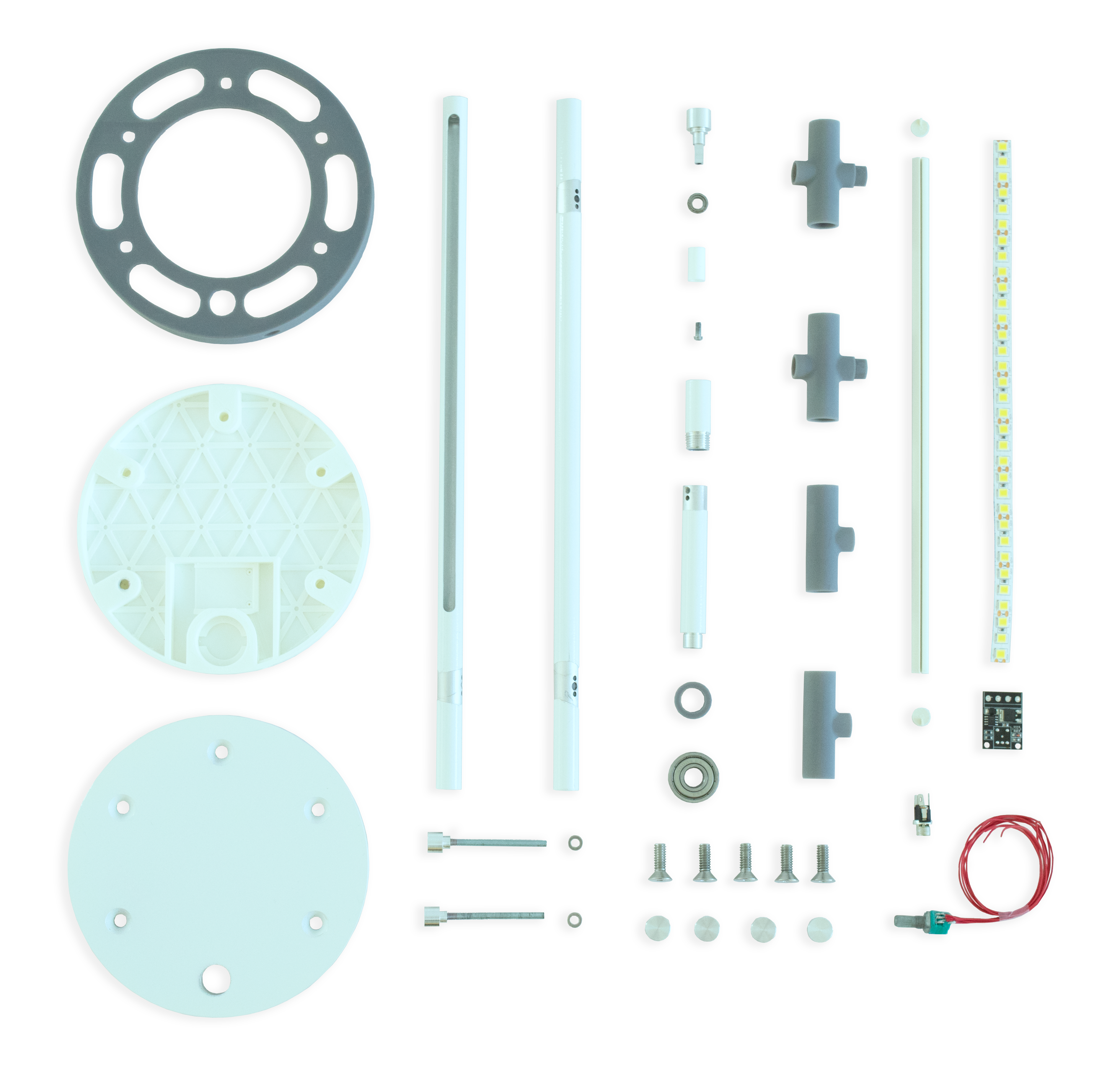 Individual lamp components spread out on the table